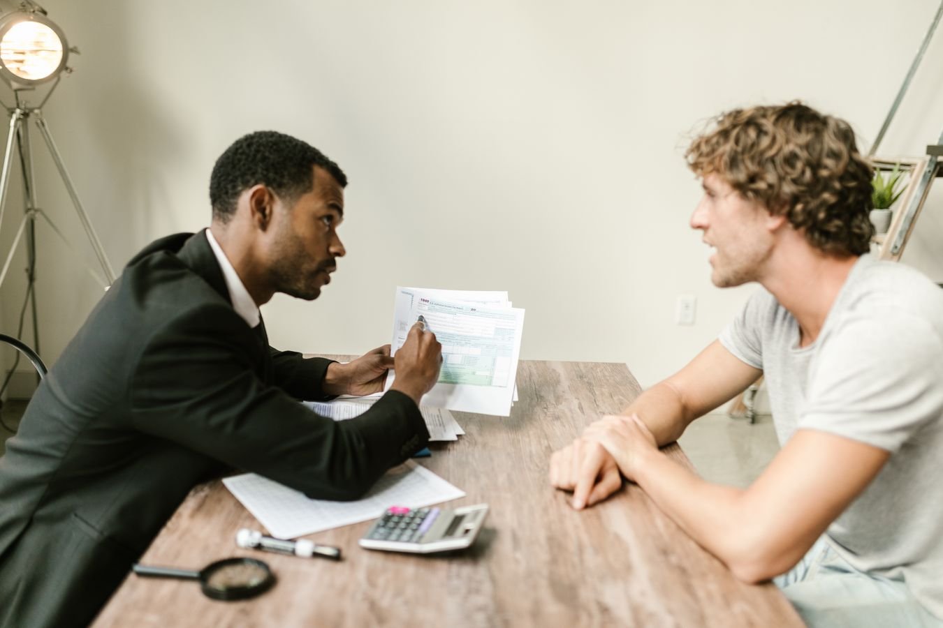 A financial adviser discussing documents with a client